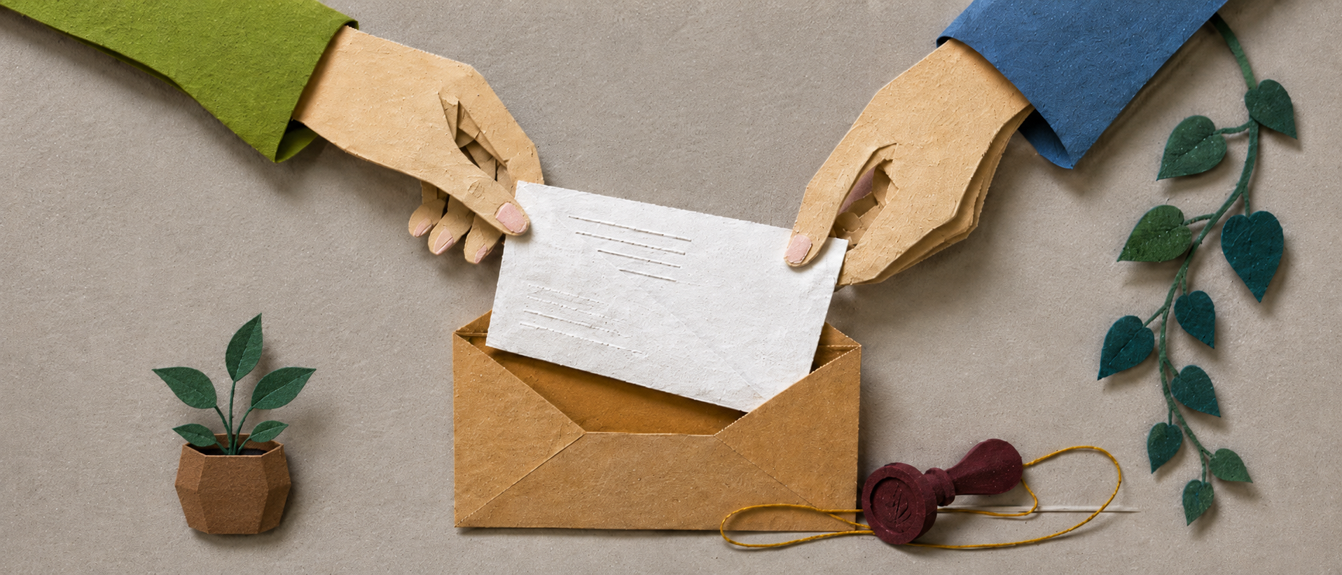 A paper collage desk with message cards, guide pages, and a contact note arranged for review.